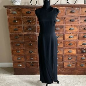 Ankle length black evening gown with keyhole back tied top and zipper bottom.